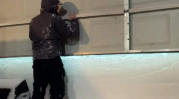 Garage Doorway Completely Blocked by Wall of Snow