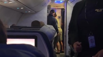 Man Attempts to Force Himself Off Plane