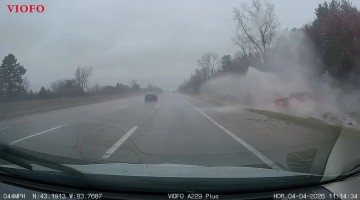 Red Pickup Hydroplanes Into Ditch
