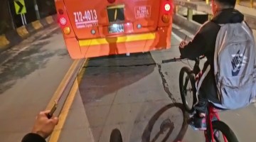 Bikers Follow Behind Bus With Tied Ropes