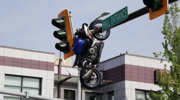 Motorcycle Hanging From Traffic Light After Collision