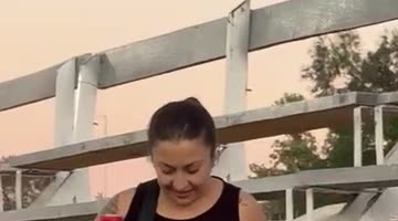 Woman Loses Balance and Takes a Slow Fall
