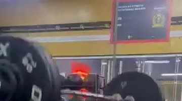 Woman Exercising Drops Weight Bar on Herself