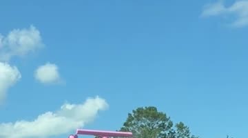 Bright Pink Boat Turns Heads on Florida Highway