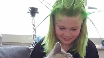 Cat Takes a Jab at Girl With Spikey Green Hair