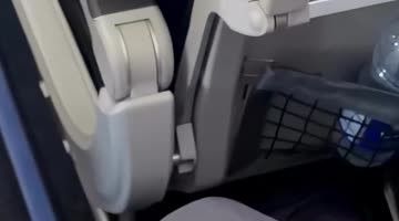 Toddler Hands Out Stickers to Passengers on Her Plane