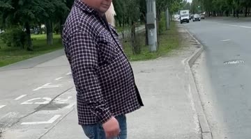 Man Walking a Toy Dog