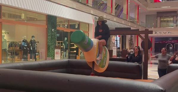 Girl Rides a Giant Bottle of Hidden Valley Ranch Dressing