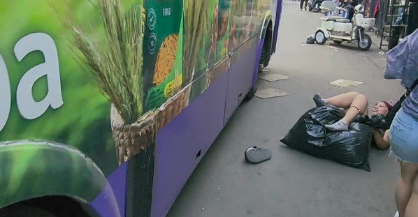 Woman Walks Into Bus Lane Without Looking