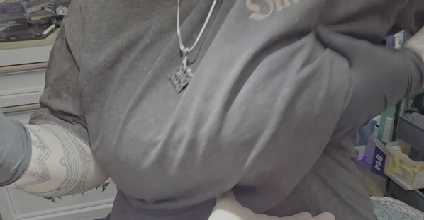 Tattoo Artist Offers Chest as Stress Ball