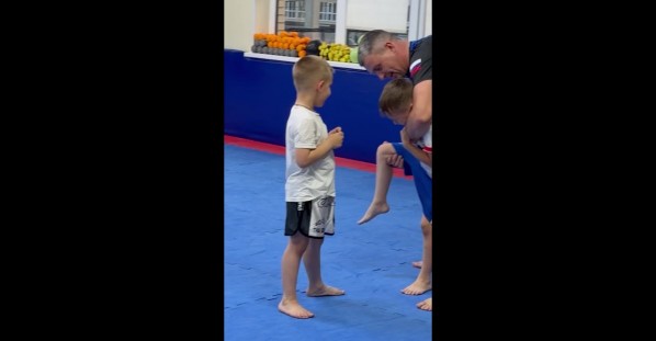 Two Boys Learning How to Properly Kick