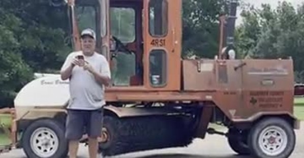 Pig Rolls Around on Freshly Laid Tar