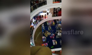 Shoppers flee in panic as mall floods following heavy rain
