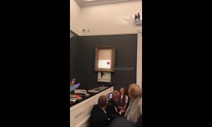 Banksy artwork self-destructs moments after selling for 1 million pounds