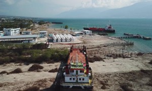 Drone footage shows large ship swept onto land by force of Palu tsunami