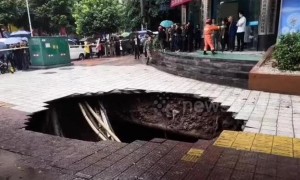 Huge sinkhole swallows up passersby on street in China