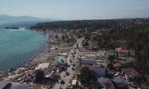 Stranded fishing boats and lone minarets: Last-ditch rescue efforts in Indonesia