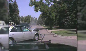 Police car gets hit by distracted driver