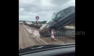 Footage shows partially upturned cars on road in aftermath of deadly Mallorca floods