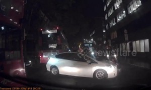 Moment 'Uber driver' collides with cyclist in busy Central London road