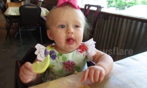 Baby eats a lemon for the first time