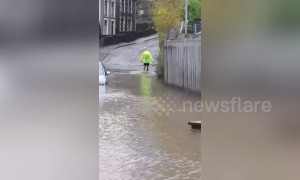 Man wades across flood because he doesn't want to extend morning run