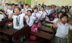 Primary school children give teacher a very enthusiastic morning greeting