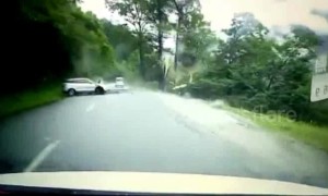 Dramatic footage shows large boulder rolling down hill and smashing car in southeast Tibet