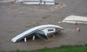 Capsized boat floats on side in Welsh harbour after Storm Callum