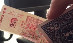 Is He Cutting the Card or the Money?