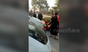Cleaner gets beaten up after stopping boy from defecating on street