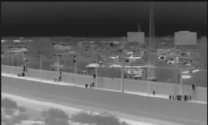 Migrants captured after dropping over border wall