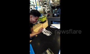 Man's ice cream plops out onto counter when he tries to prove how thick it is