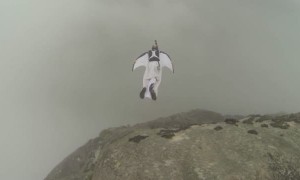 Wingsuit BASE Jumper Lands Through Roof