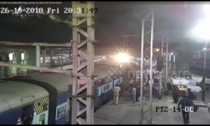 Indian police officer saves man hanging from moving train