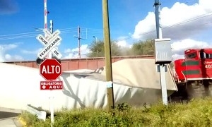 Truck Crosses Train Track at the Worst Possible Time