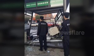 Out-of-control car ploughs into security booth injuring two