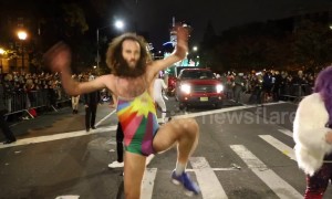 Man in woman’s bathing suit performs striptease dance at NYC Halloween parade