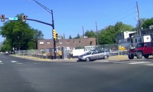 Car drives along sidewalk at intersection