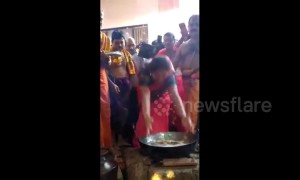 Hindu devotees engage in fiery rite by dipping hands in boiling oil to fulfil vow