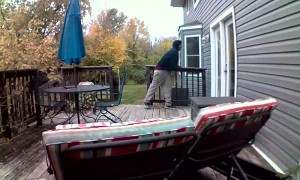 Man Smashes Glass Door with Rock