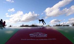 YouTuber dad tries to impress kids by doing backflips on inflatable fun pad