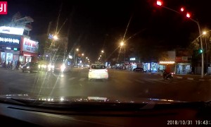 Bus Grazes Man on Motorcycle