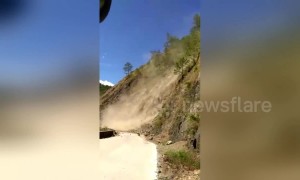 Terrifying moment bus passengers scream after getting stuck yards from landslide