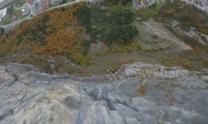 French daredevil rides bike off sheer cliff before parachuting into Alpine village