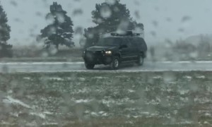Driver Fishtails on I-80 in Snowy Conditions