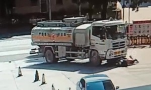Scooter driver narrowly escapes being run over by truck