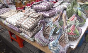 Venezuelan migrants sell handcrafts made of worthless money in Colombia