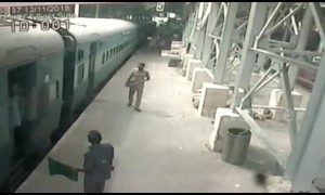 Hero cop saves woman from slipping under moving train