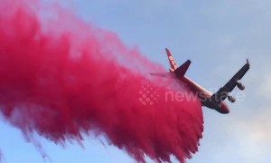 Footage shows air tanker dropping long stream of retardant to fight Camp Fire